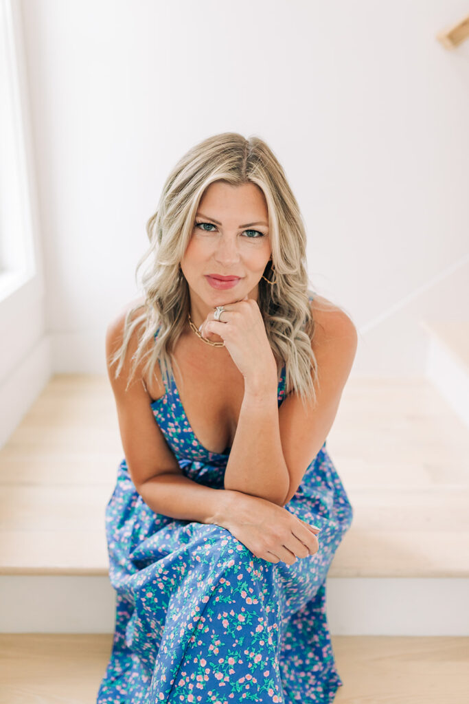 woman posing in blue floral flowy dress
