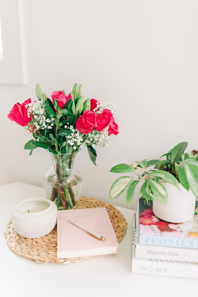 work from home desk with flowers and a candle