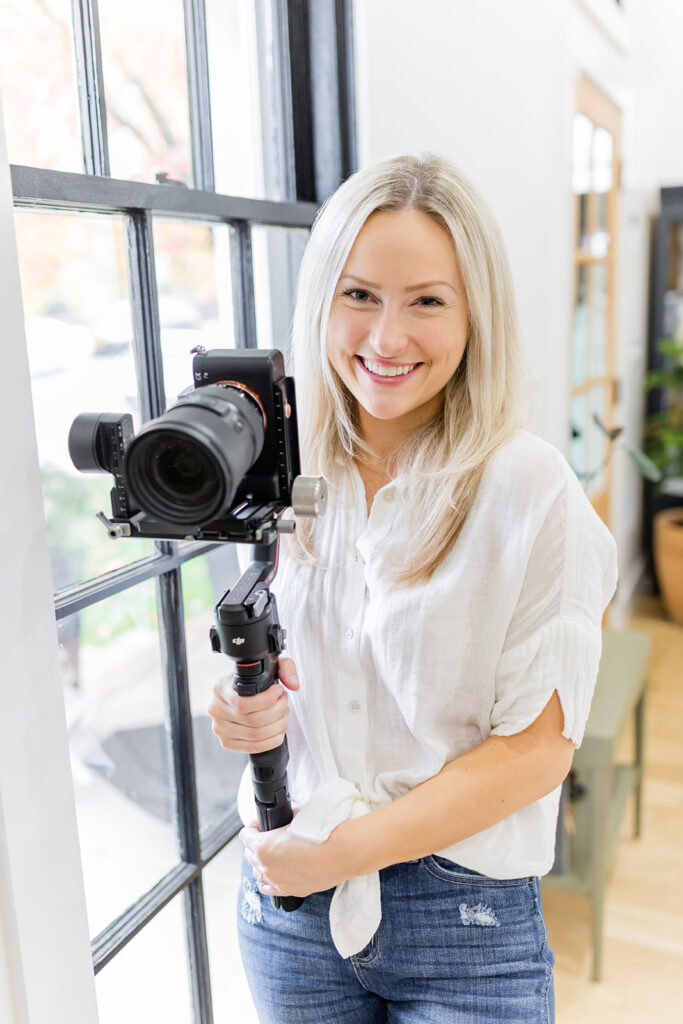 user-generated content creator smiling with video camera