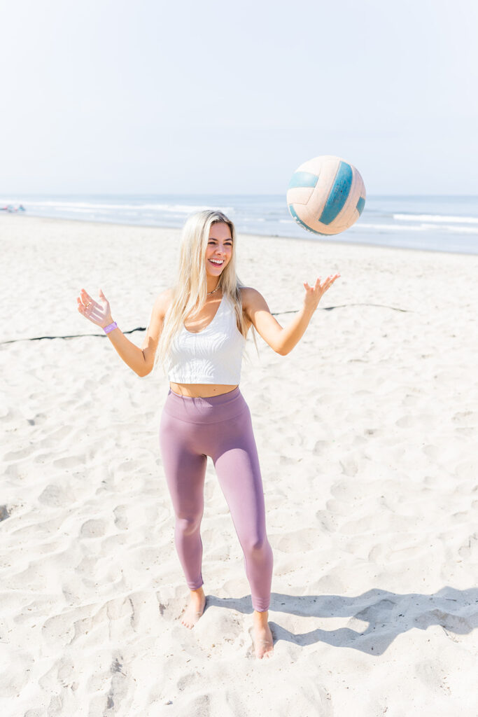 woman doing a beach volleyball workout outdoors