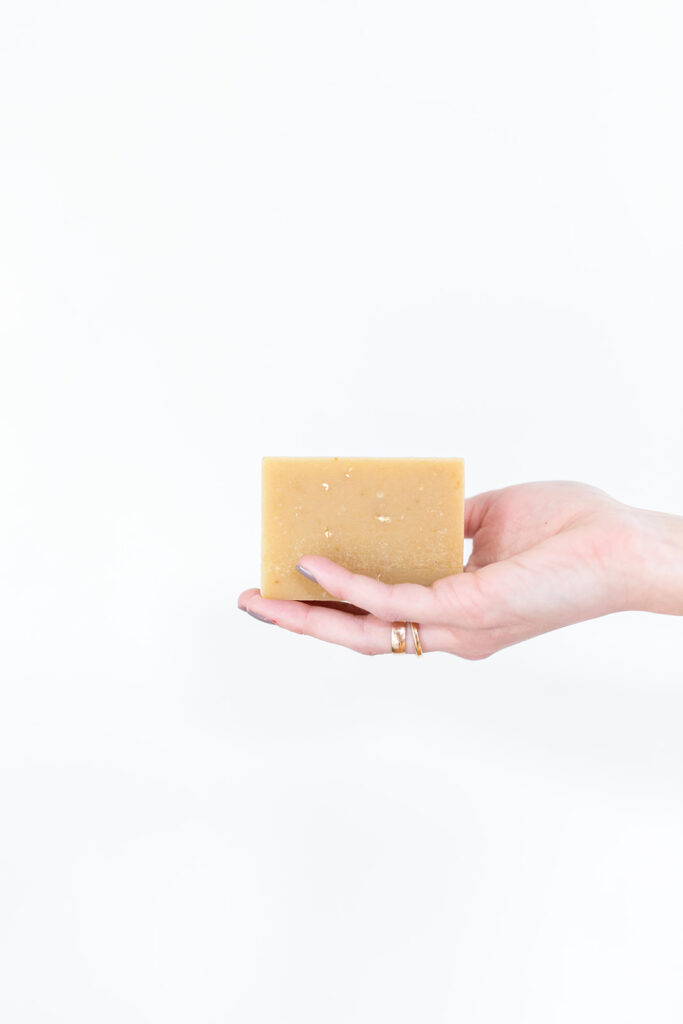 hand holding bar of handmade soap