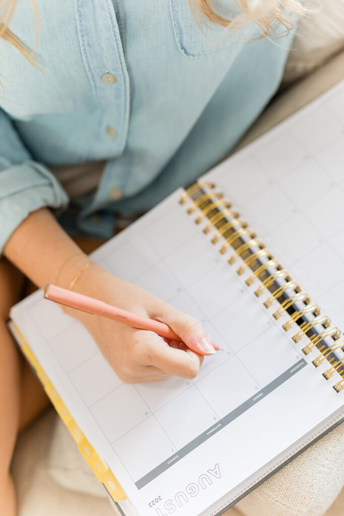 woman journaling in planner