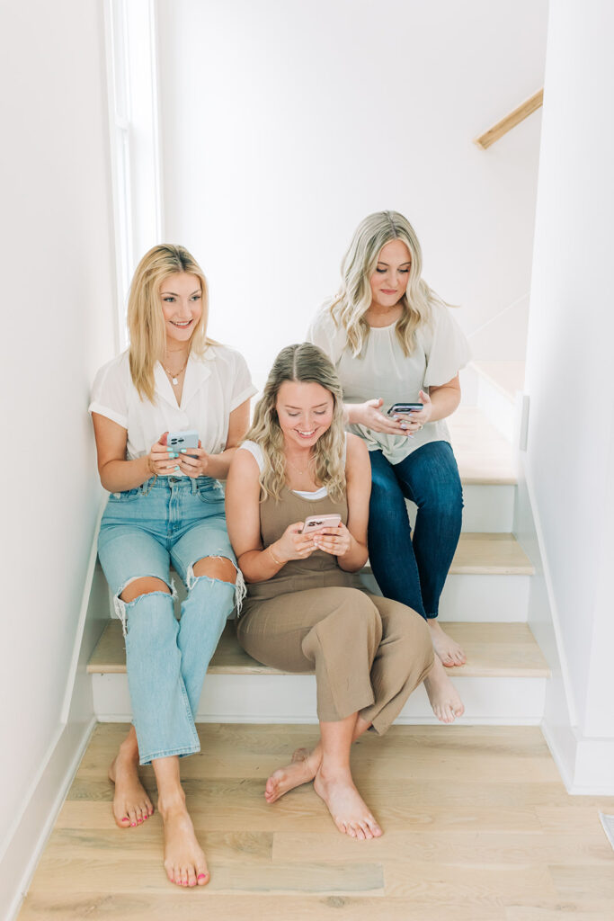 social media professionals working on phones in stairwell