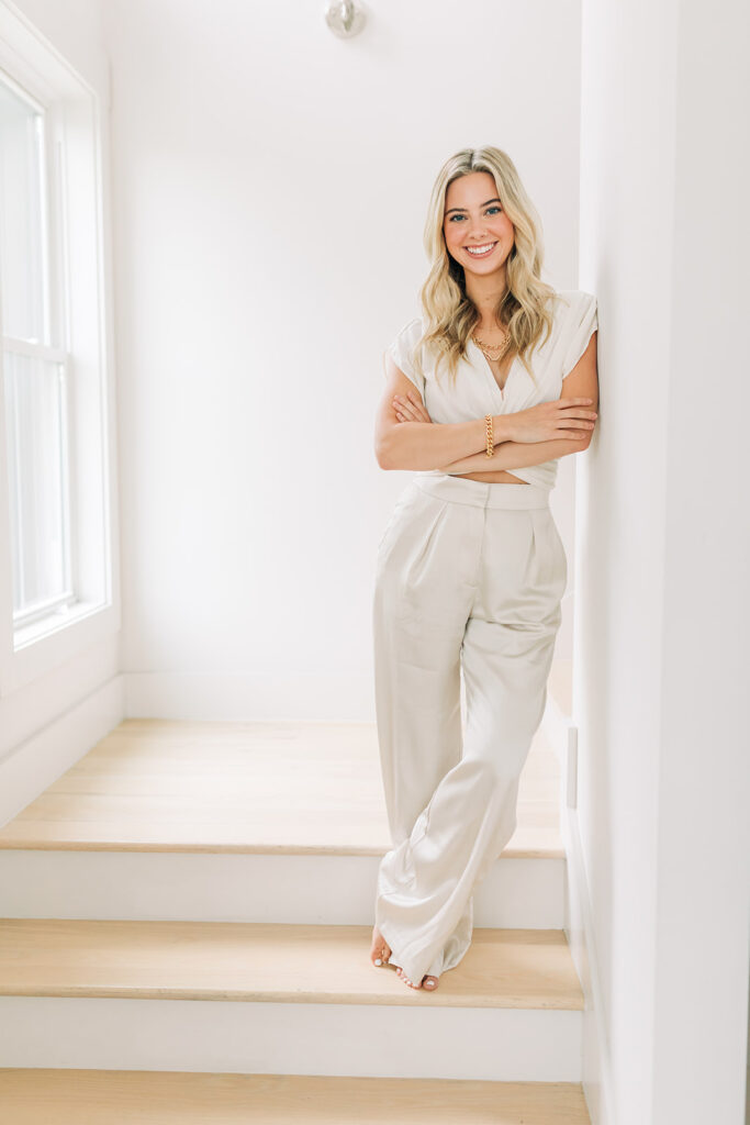 confident smiling woman with arms crossed