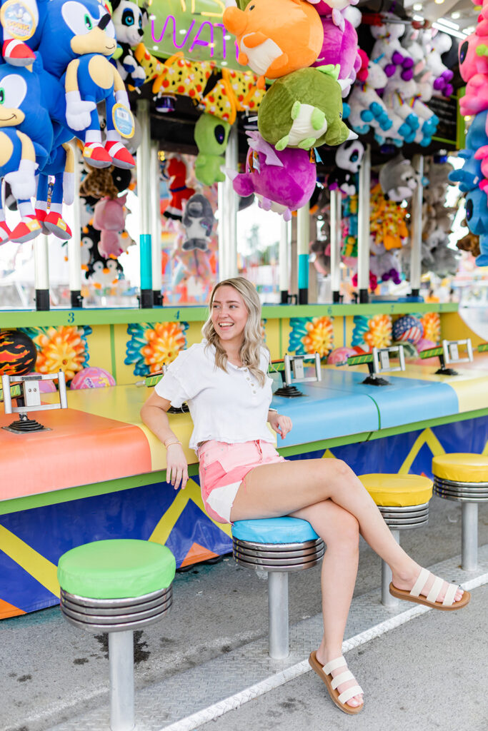 woman sitting at fair with slide on sandals