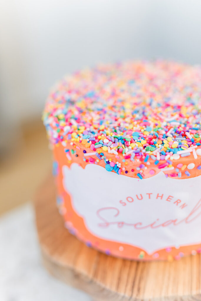 pink southern social cake with sprinkles